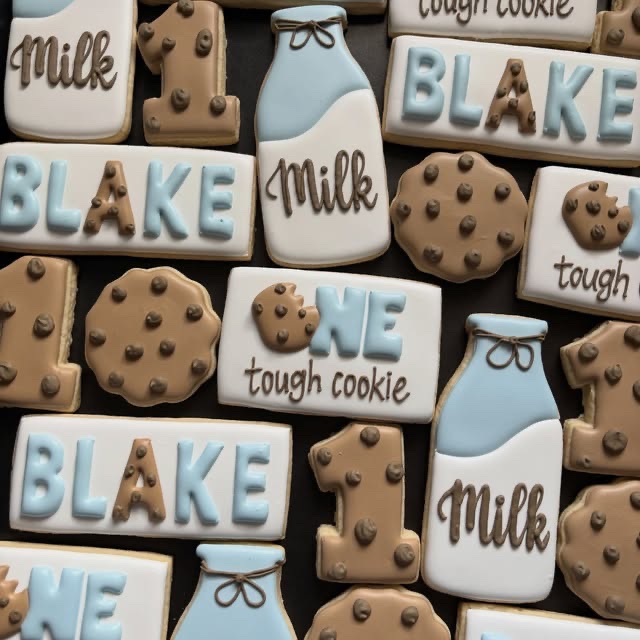 Milk-and-cookies themed birthday set: a glass of milk, chocolate chip cookies, a number and a plaque reading Blake is one tough cookie.